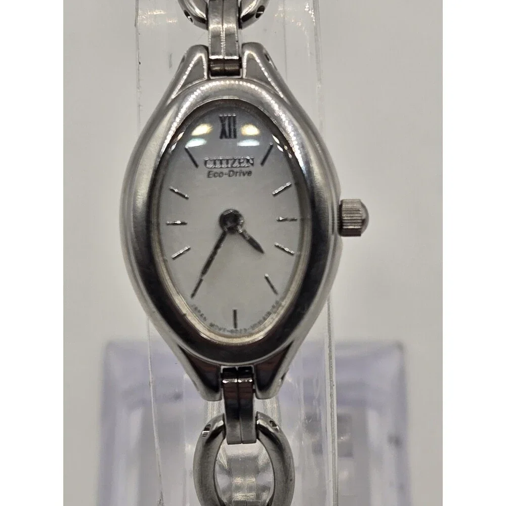 Citizen Eco-Drive Oval Silver Tone White Dial Heart Charm Bracelet Watch.